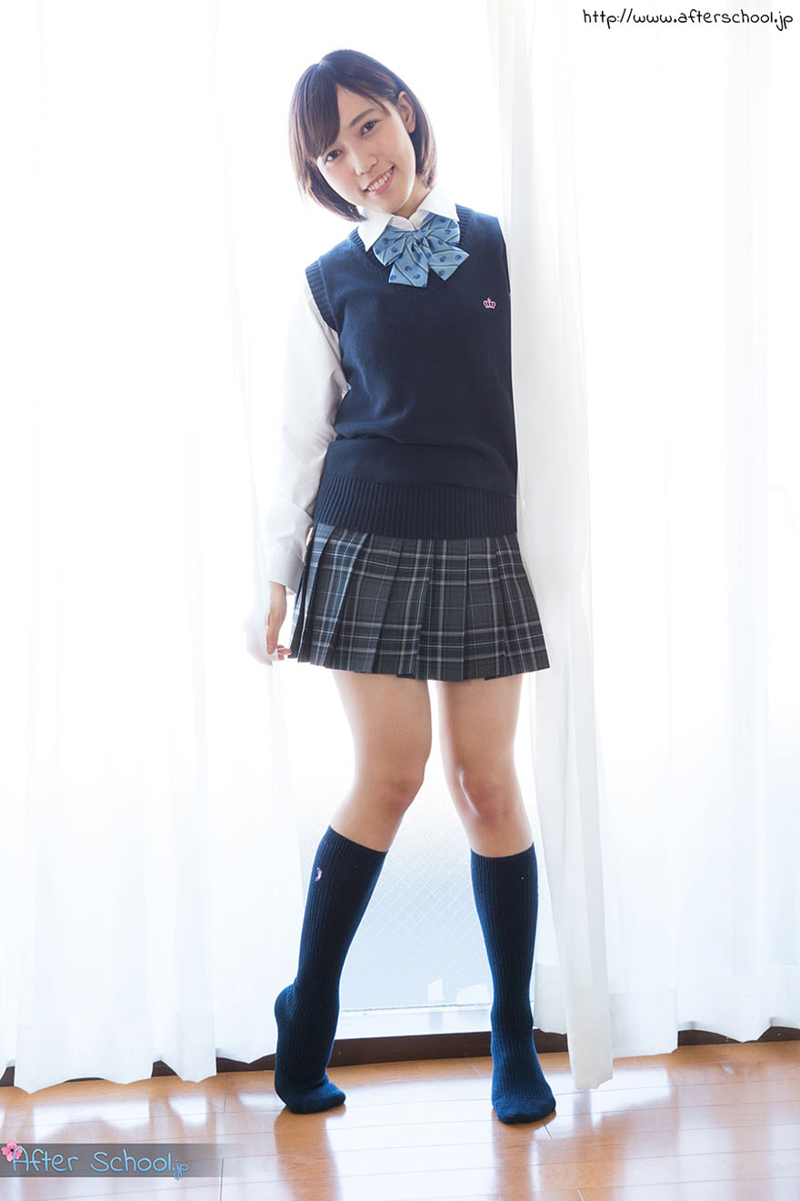 Cute Schoolgirl In Uniform Posing In Knee Socks