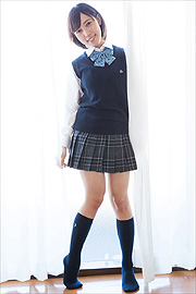 Cute Schoolgirl In Uniform Posing In Knee Socks