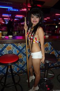 Sweet Thailand Bar Girl Holding A Pool Stick