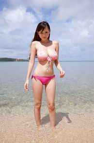 Chesty Bikini Girl From The Orient Ankle Deep In Water