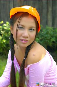 Darling Young Asian Woman With Pigtails