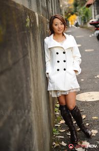 Pretty Young Woman From Japan In Boots And Outfit
